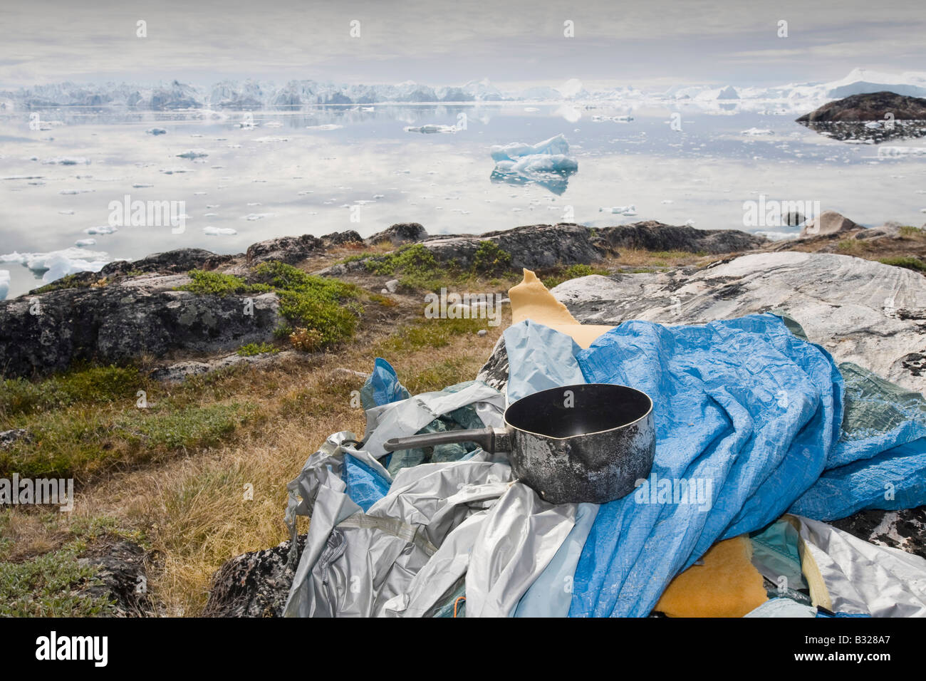 The irony of someone leaving their trassh behind in the UNESCO World Heritage Site of Ilulissat Icefjord on Greenland Stock Photo