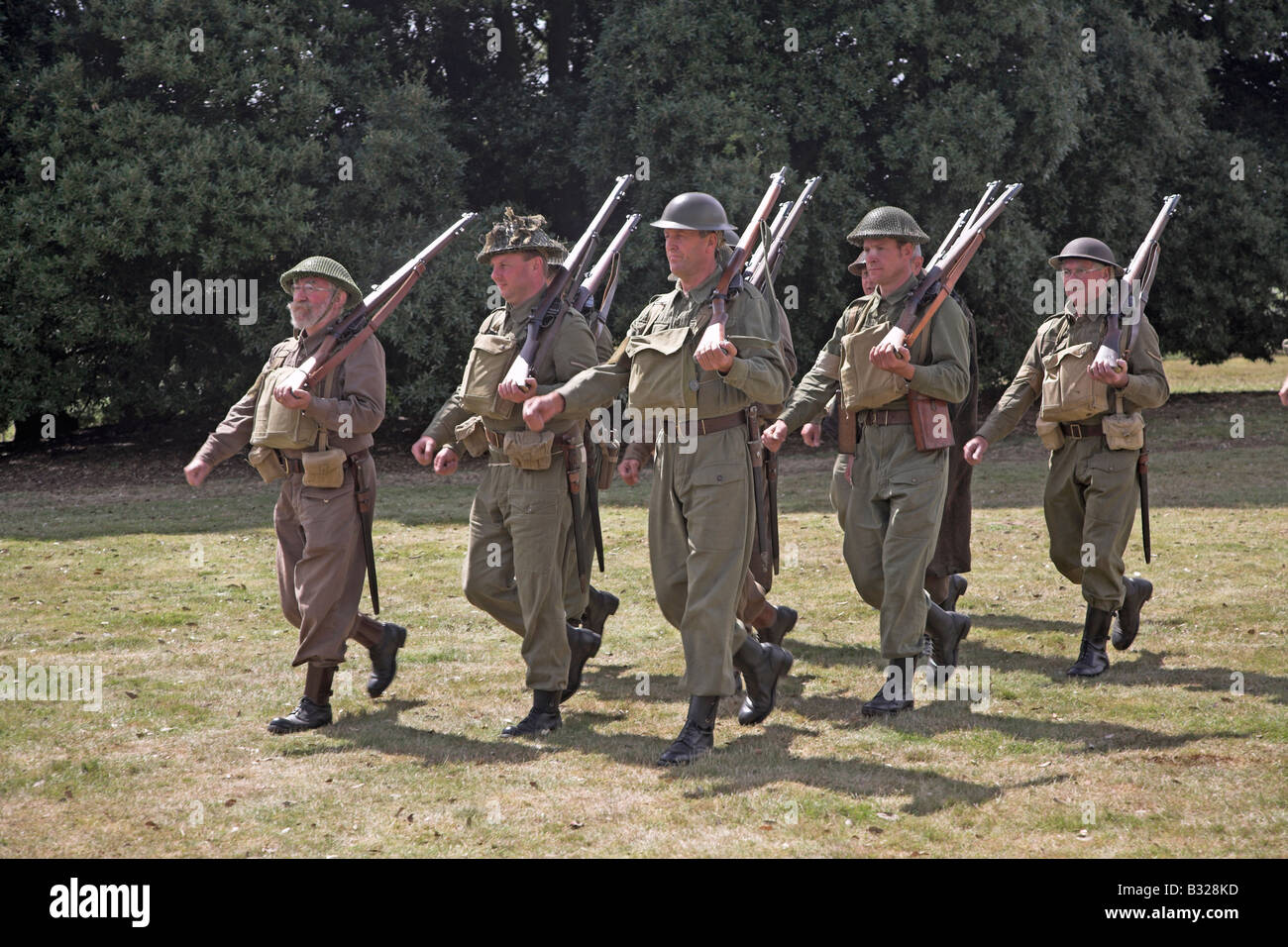 Home Guard soldiers marching in uniform during 1940s second world war re-enactment Stock Photo