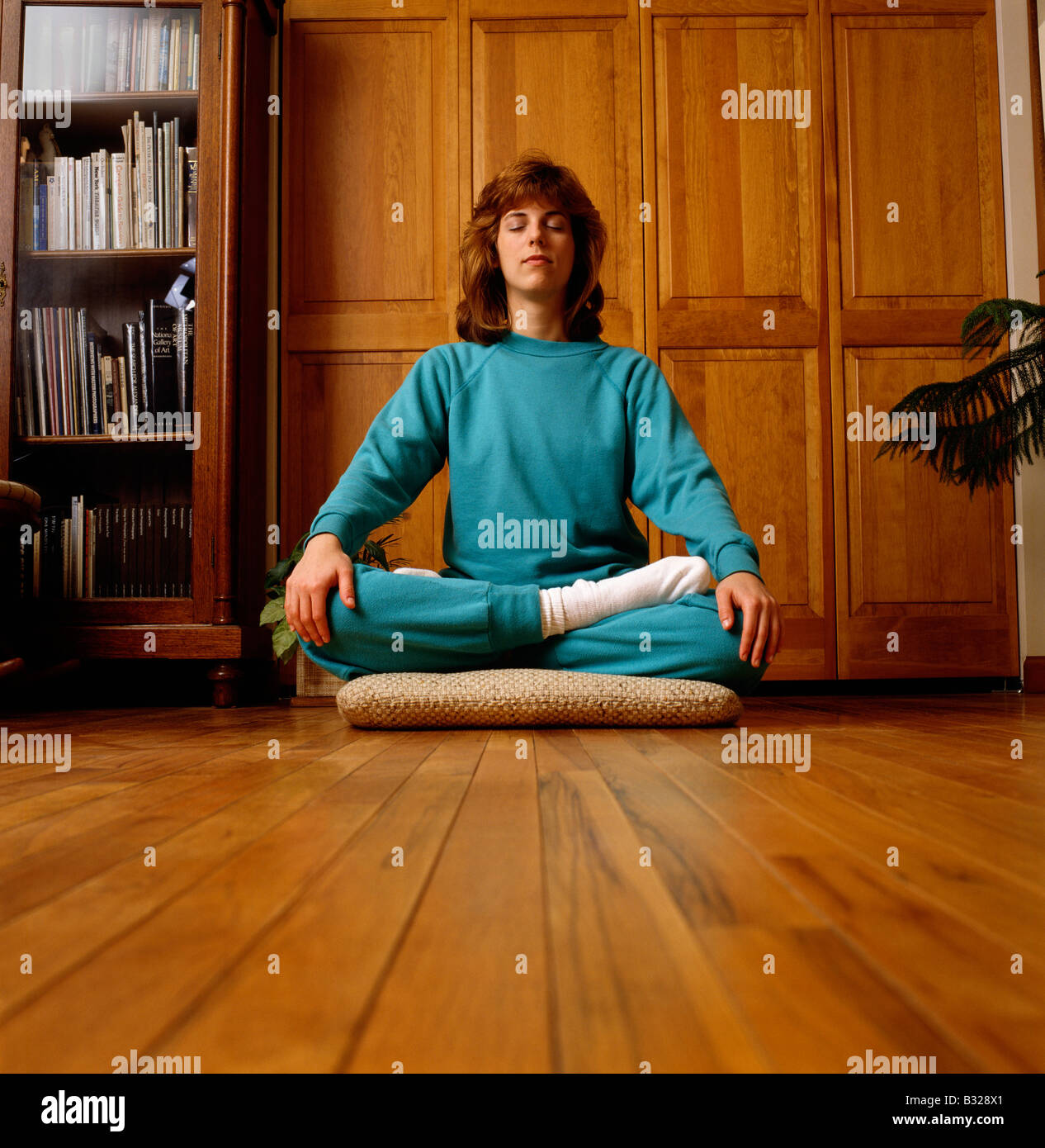 Young woman doing yoga Stock Photo - Alamy