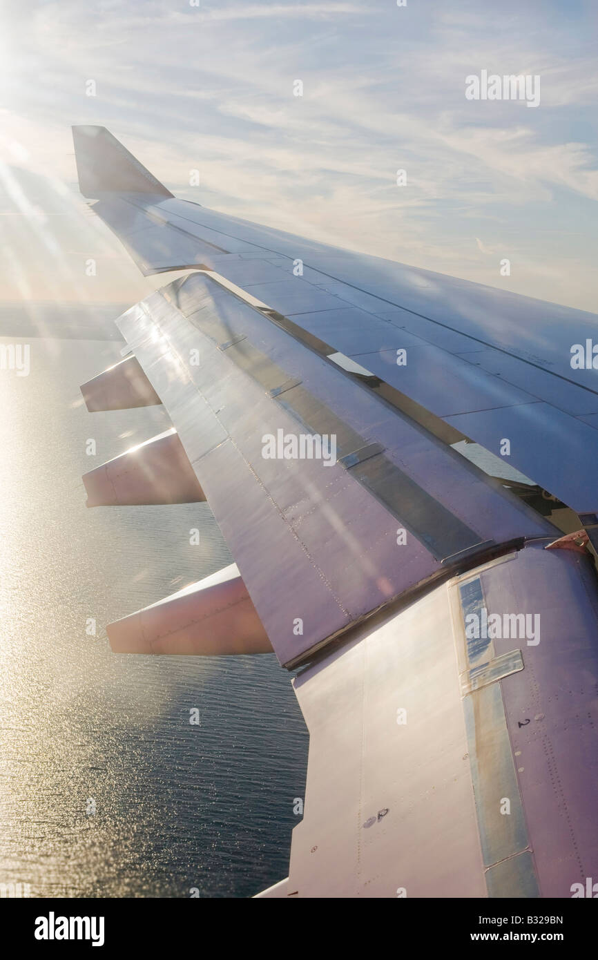 A plane wing with the flaps down as it comes in to land at Copenhagen airport in Denmark Stock Photo