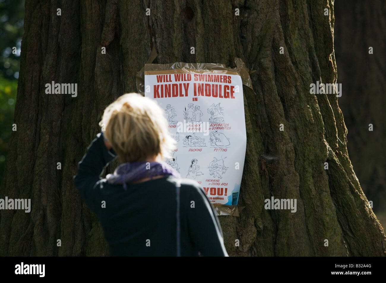 A poster taped to a tree by the Secret Swim at The Big Chill Festival 2008, Eastnor, Herefordshire Stock Photo