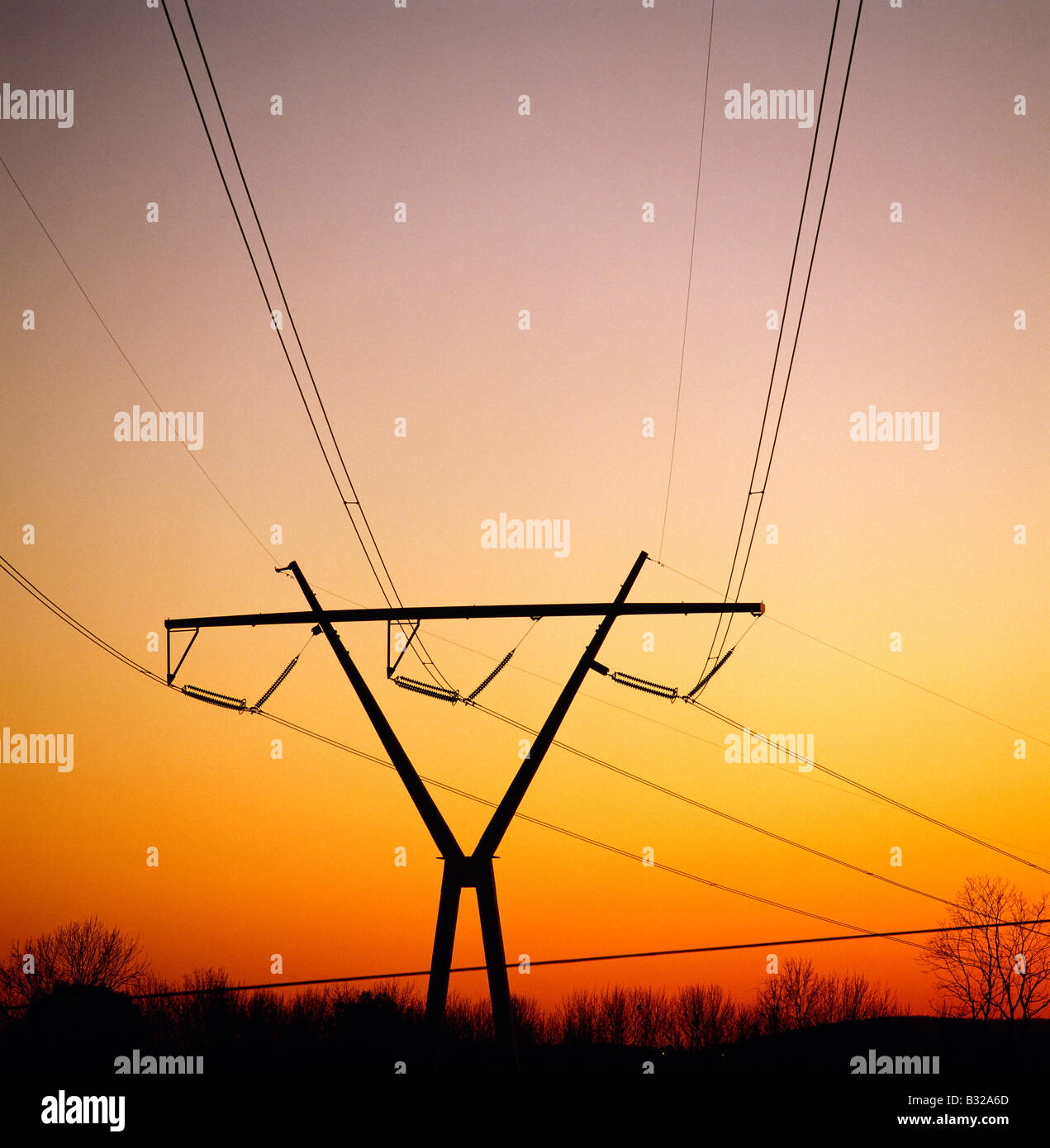 Electrical transmission lines near a nuclear power plant; sunset view