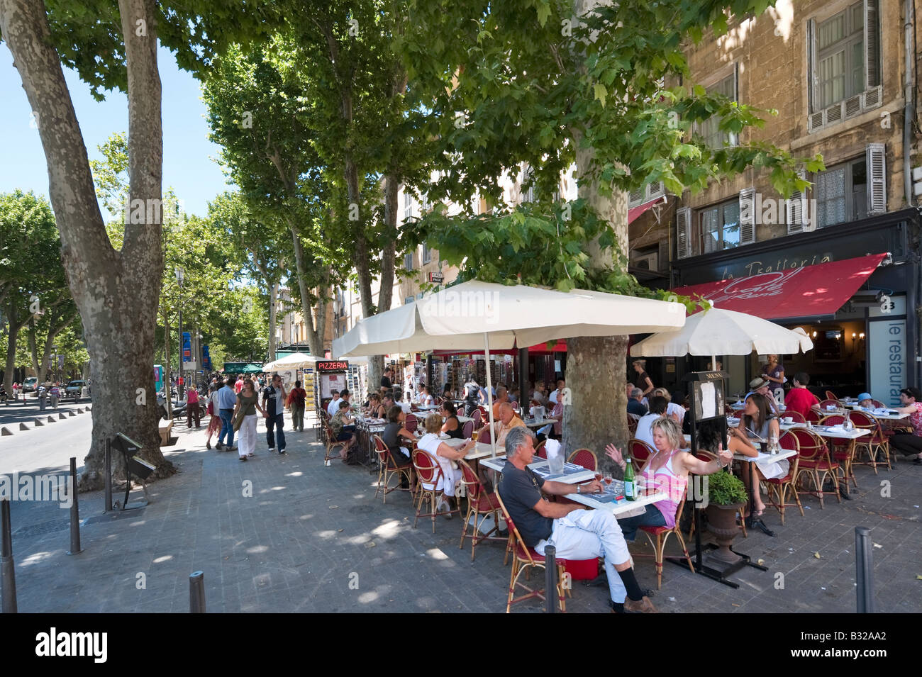 Street cafe on the Cours Mirabeau in the historic city centre Aix en Provence France Stock Photo