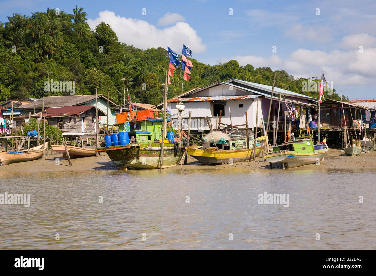 Riverside village along the Kuching River Sarawak Borneo Stock Photo