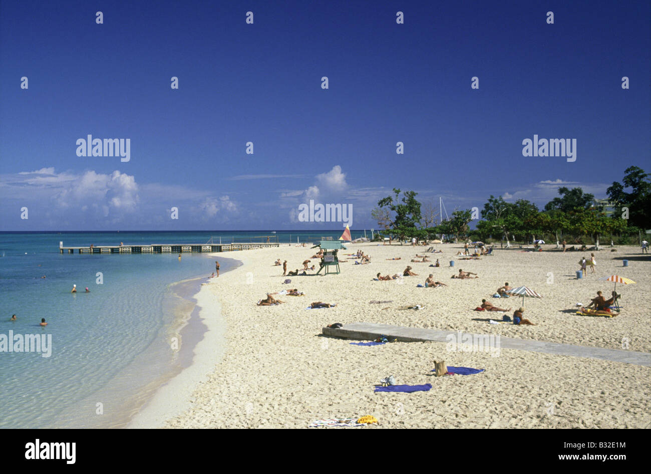 Doctor's Cave Beach People sunbathing and in sea Lifeguard hut MONTEGO