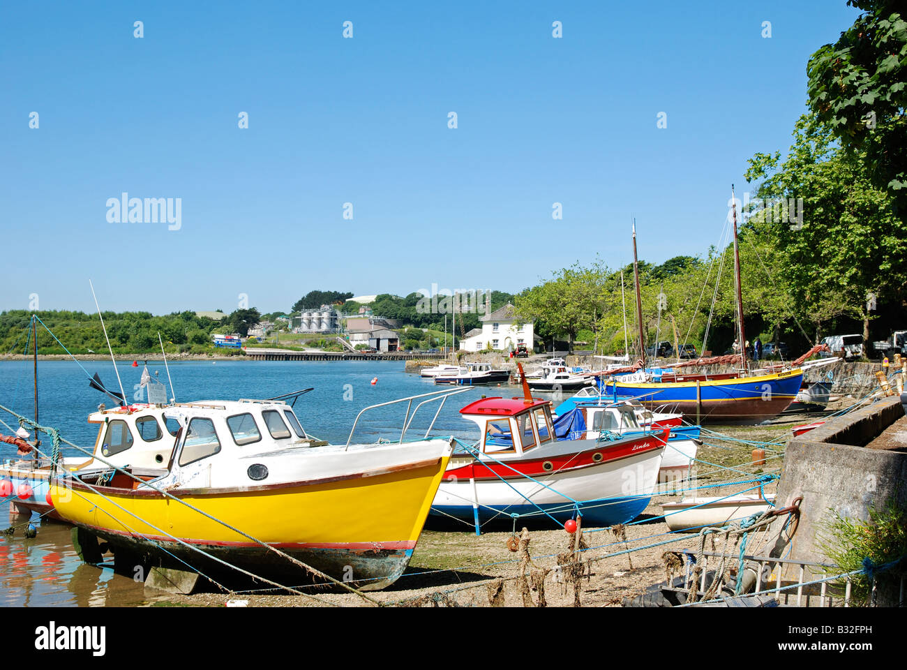 small fishing boats moored at 'sunny corner' on the river fal near truro,cornwall,uk Stock Photo