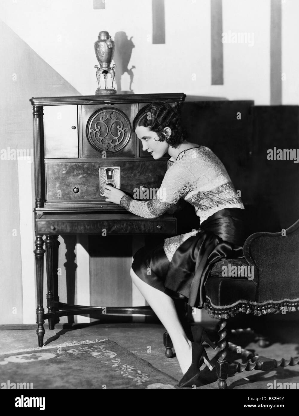 Woman tuning radio hi-res stock photography and images - Alamy