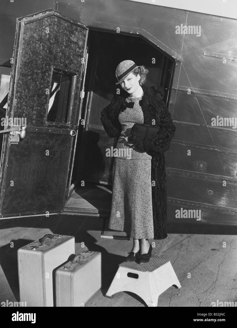 Woman steps plane happy hi-res stock photography and images - Alamy