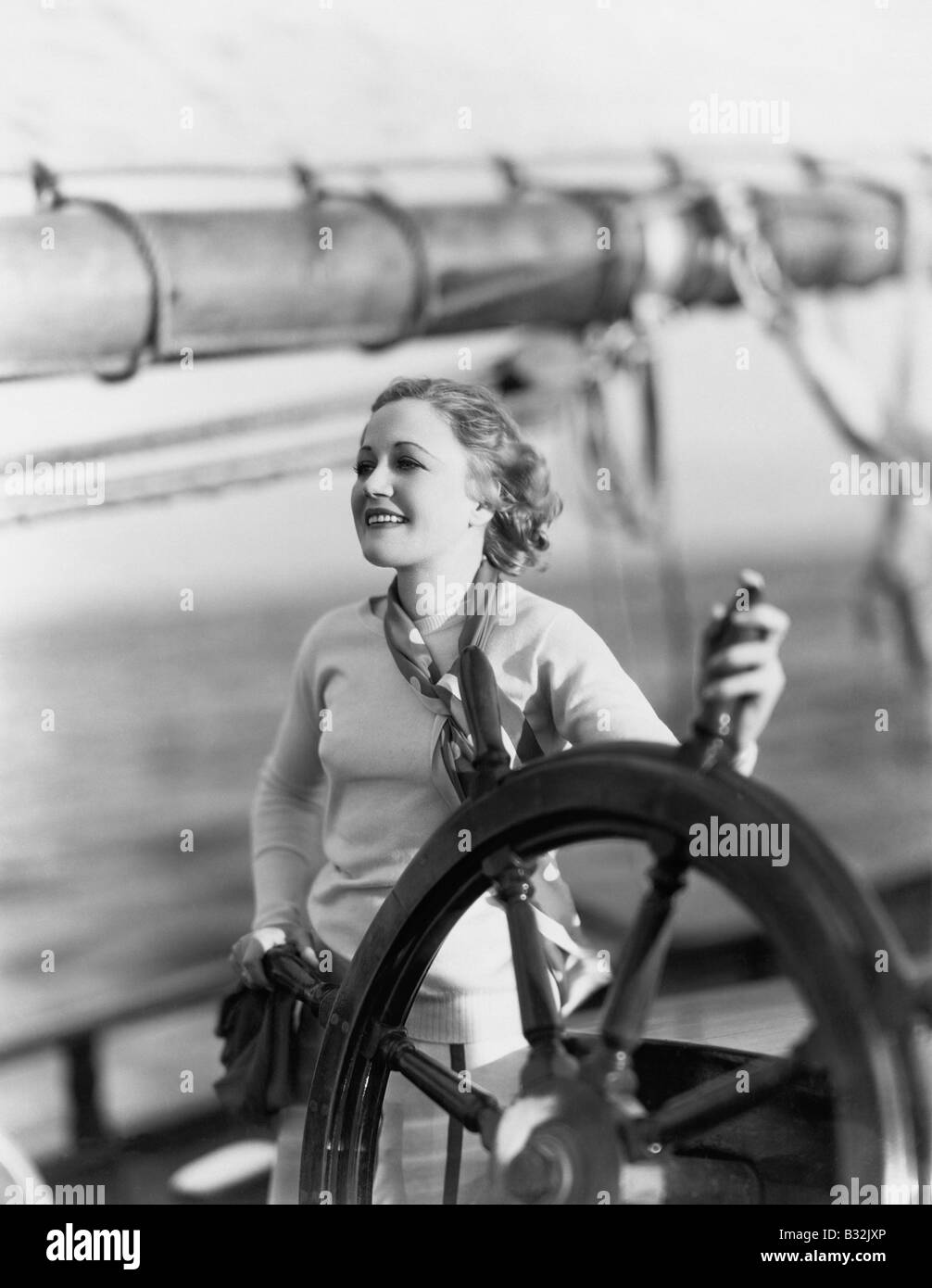 Young woman at helm sailboat hires stock photography and images Alamy