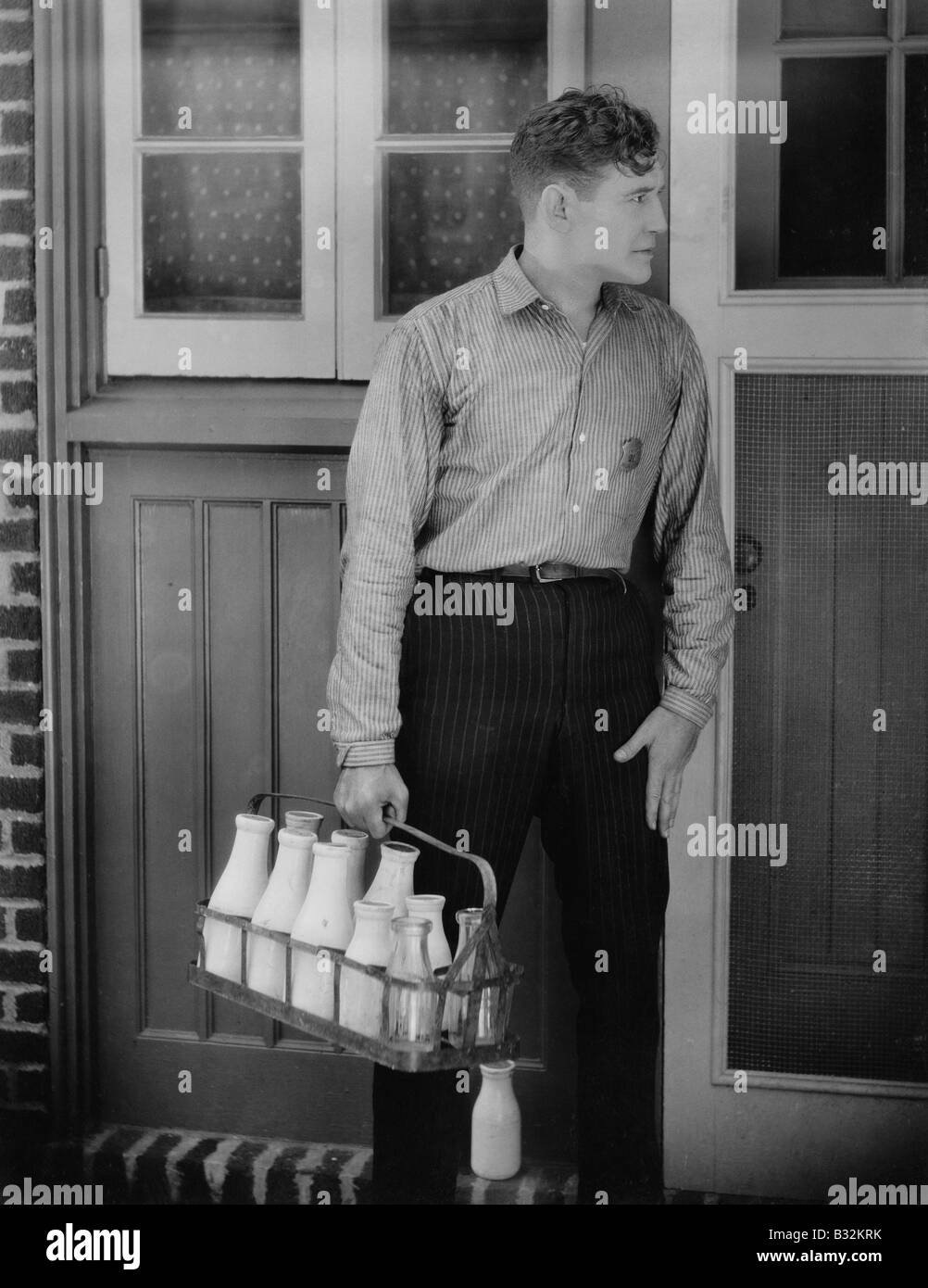 Man delivering milk Stock Photo
