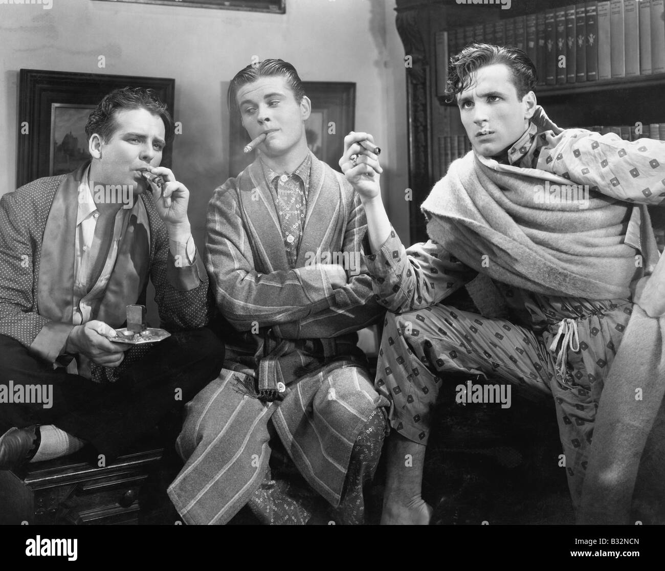 Three men smoking cigars Stock Photo