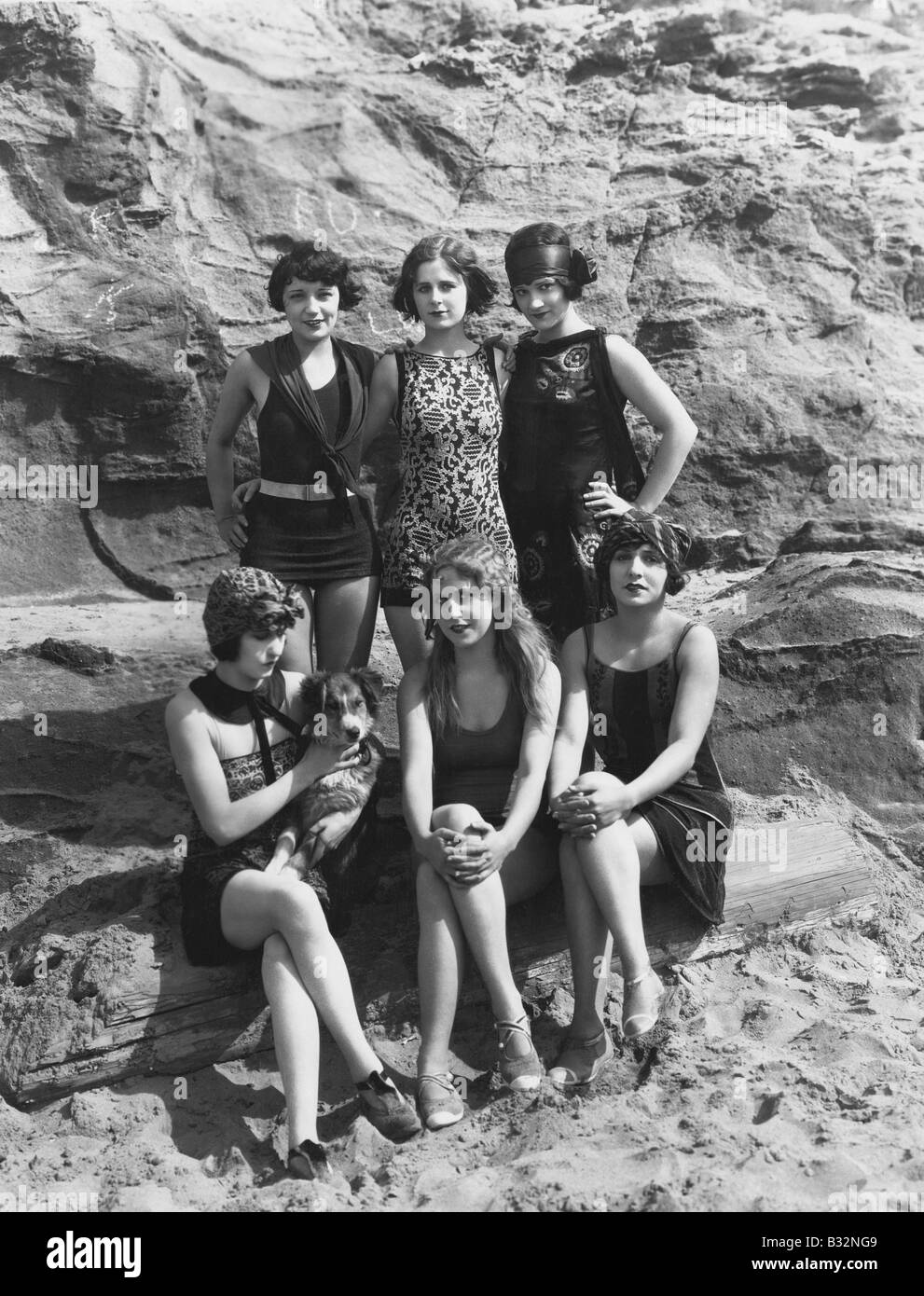 Portrait of women on beach with dog Stock Photo