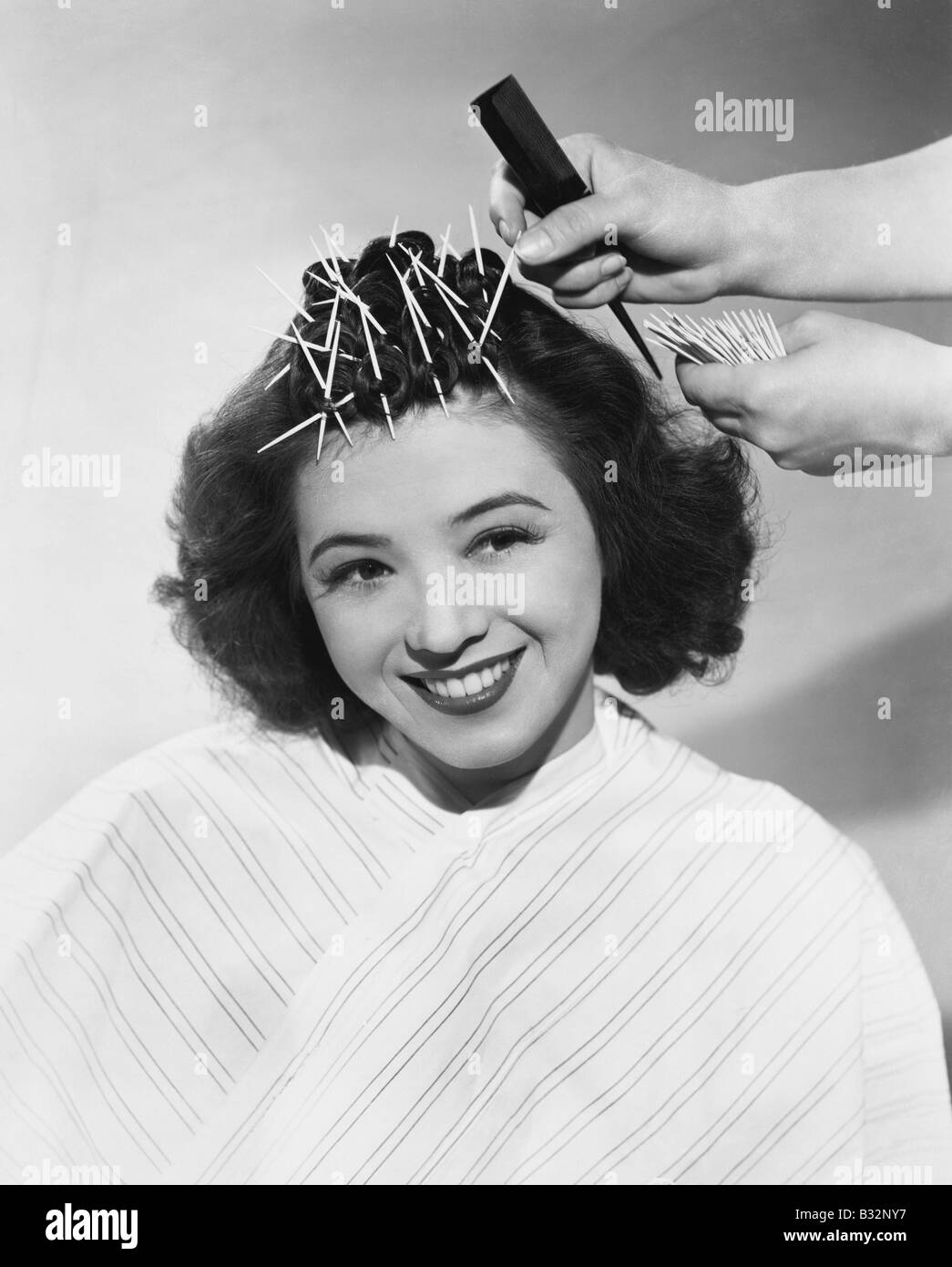 Portrait of woman having hair styled Stock Photo