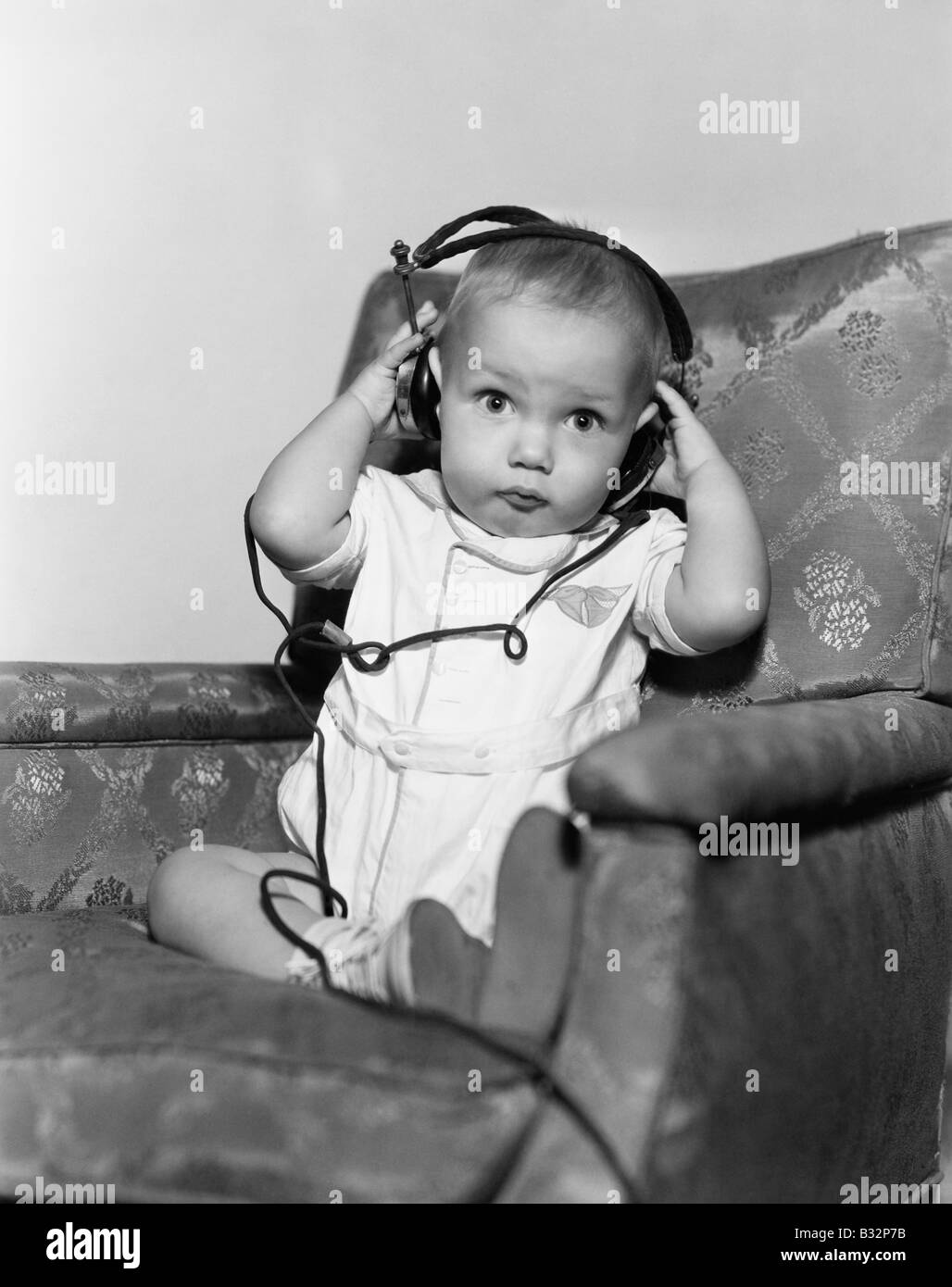 Portrait of baby wearing headphones Stock Photo Alamy