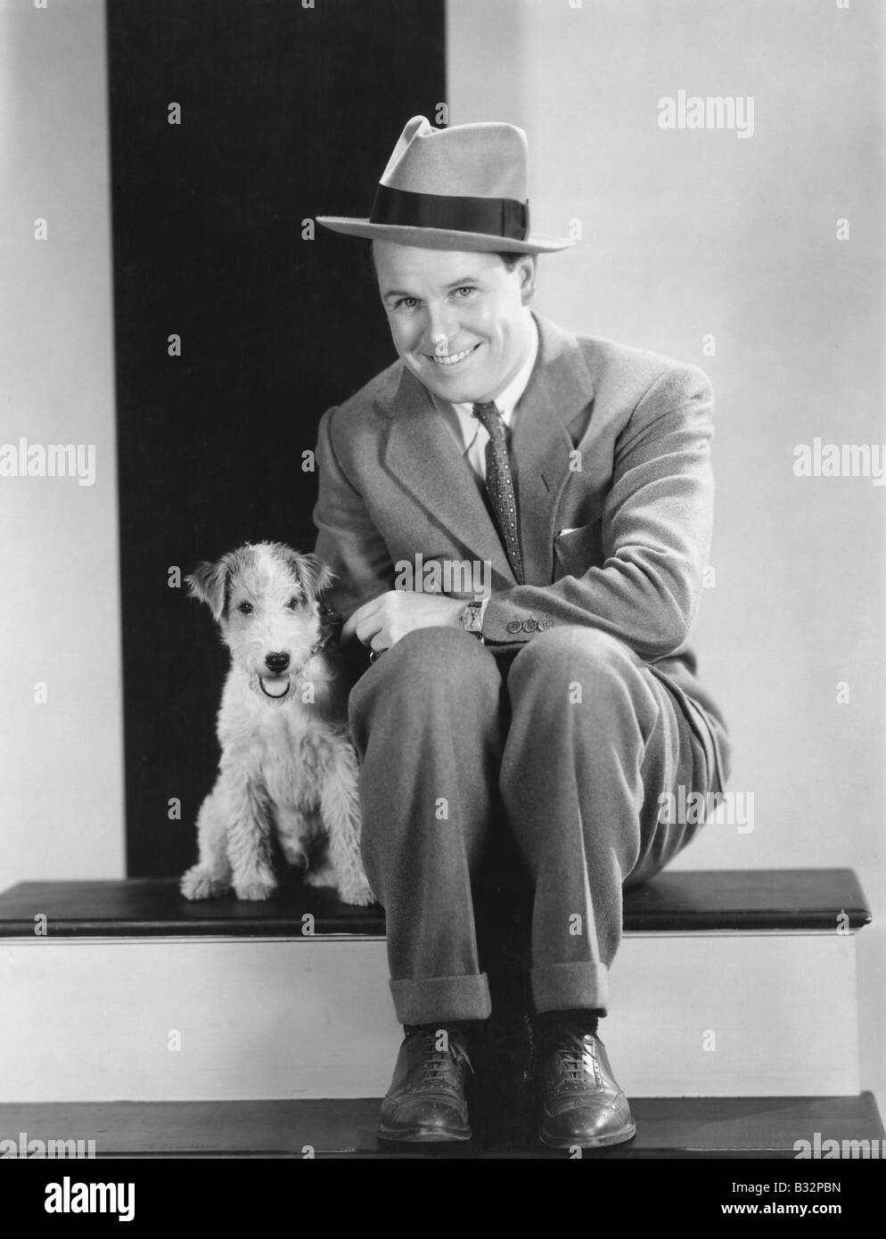 Portrait of man with puppy Stock Photo - Alamy