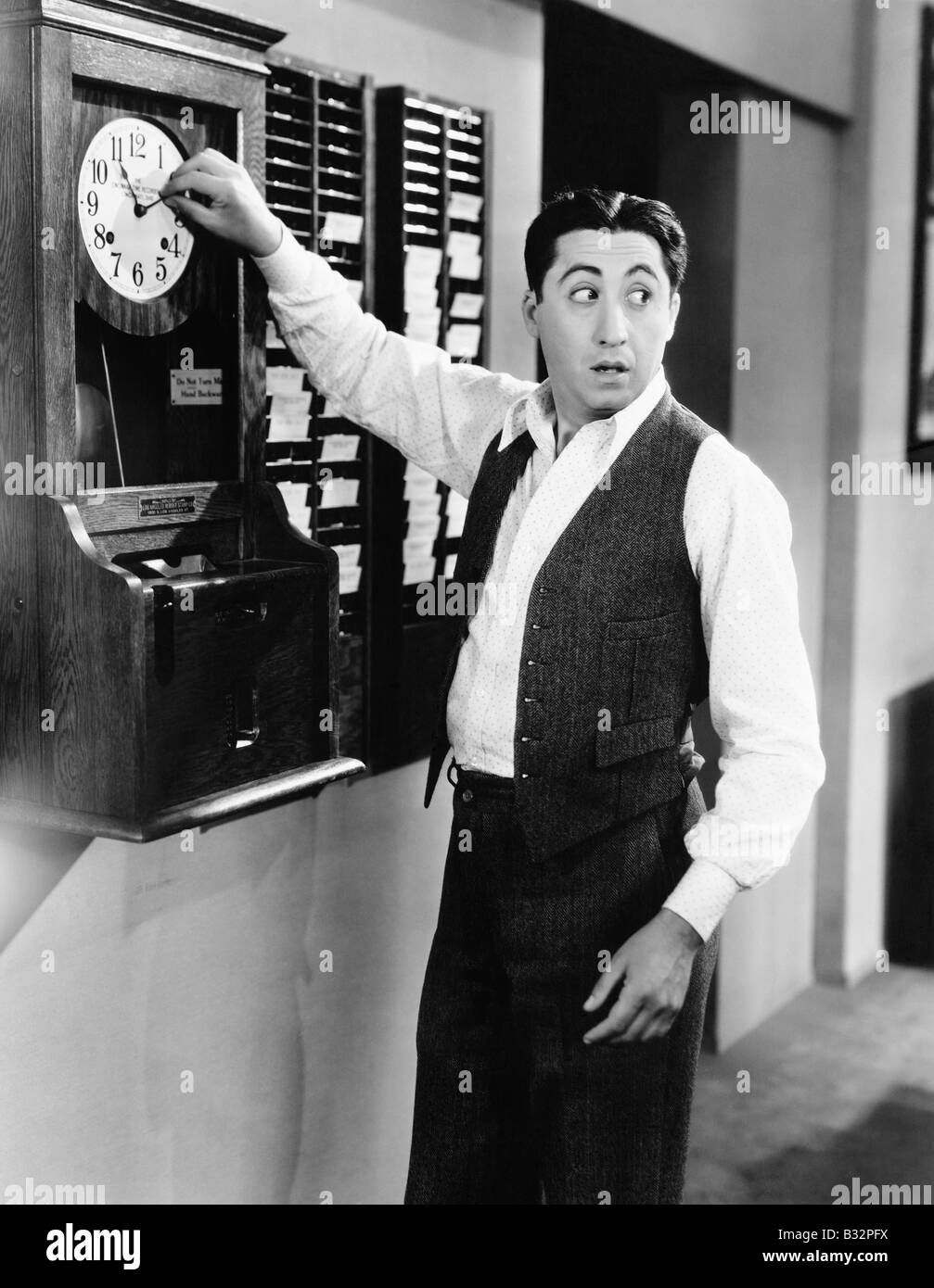 Employee changing time clock Stock Photo Alamy