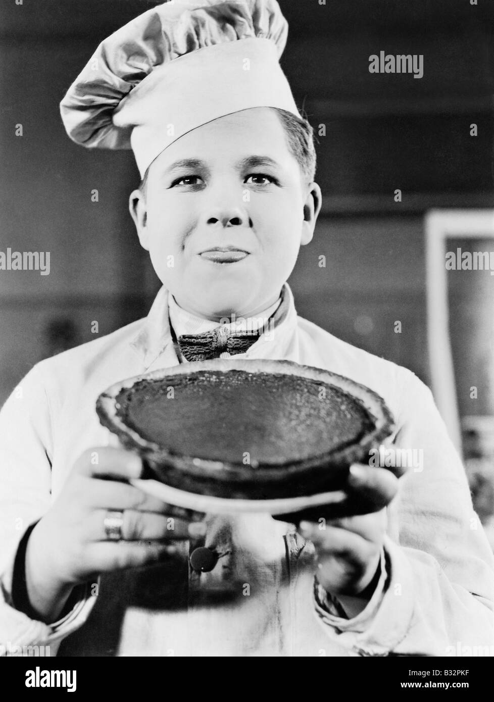 Portrait of chef with pie Stock Photo
