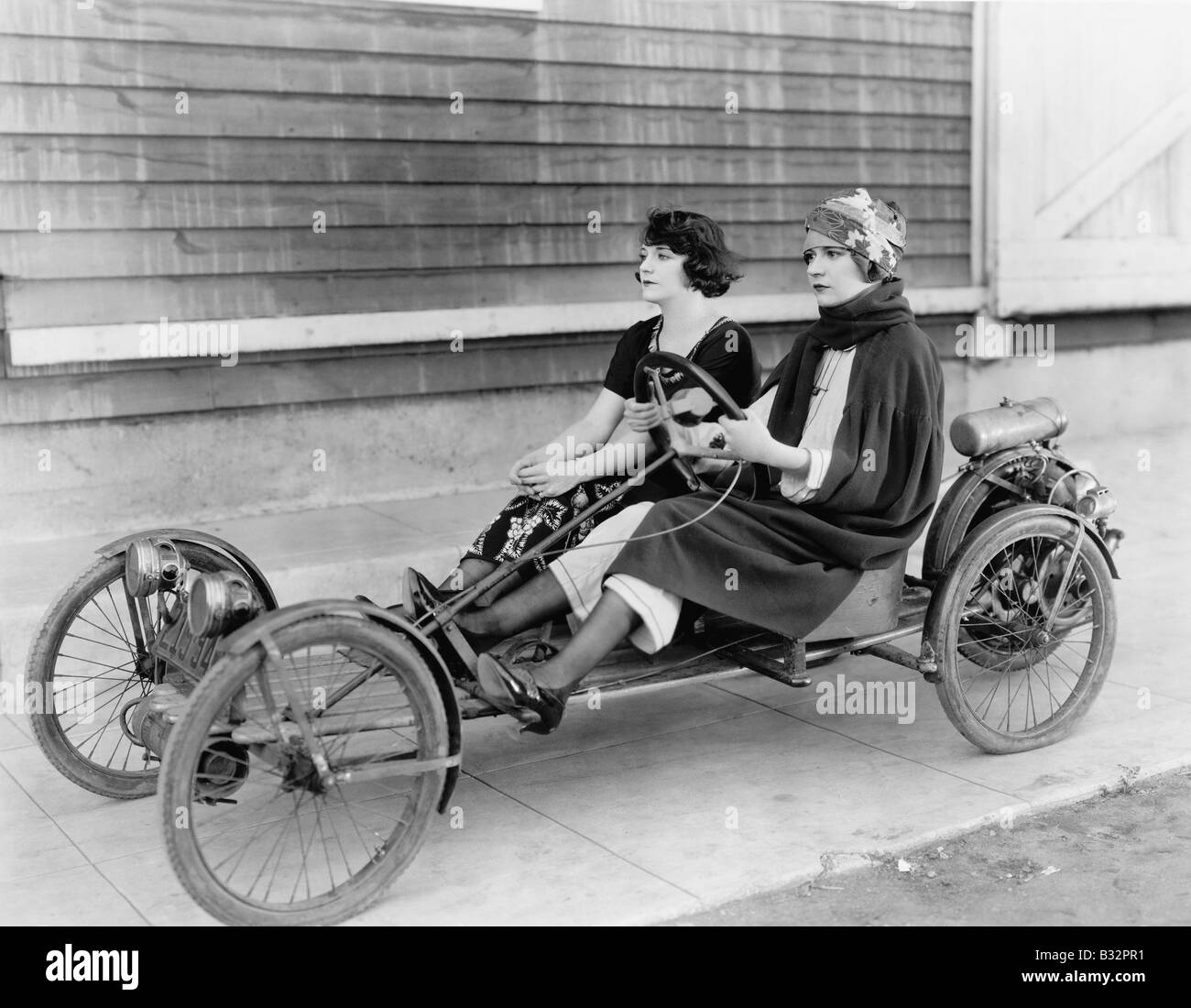 Two women in go kart Stock Photo