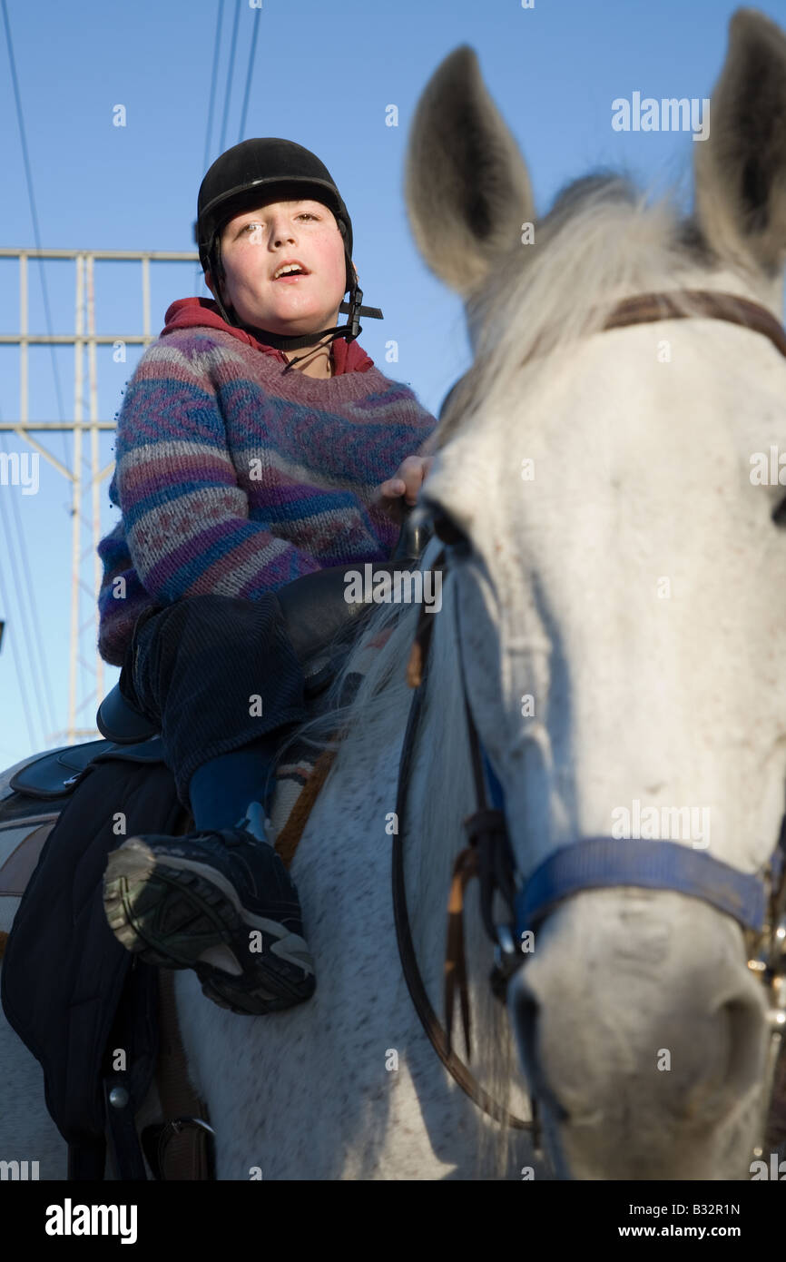Photo of Twelve Year Old Boy Suffering From CP in Horseback Riding Therapy Stock Photo