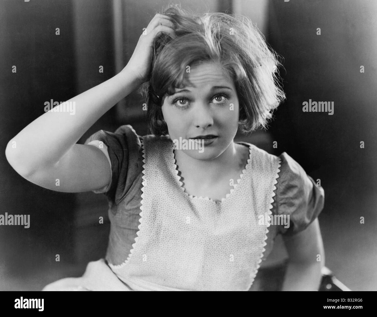Woman scratching her head Stock Photo