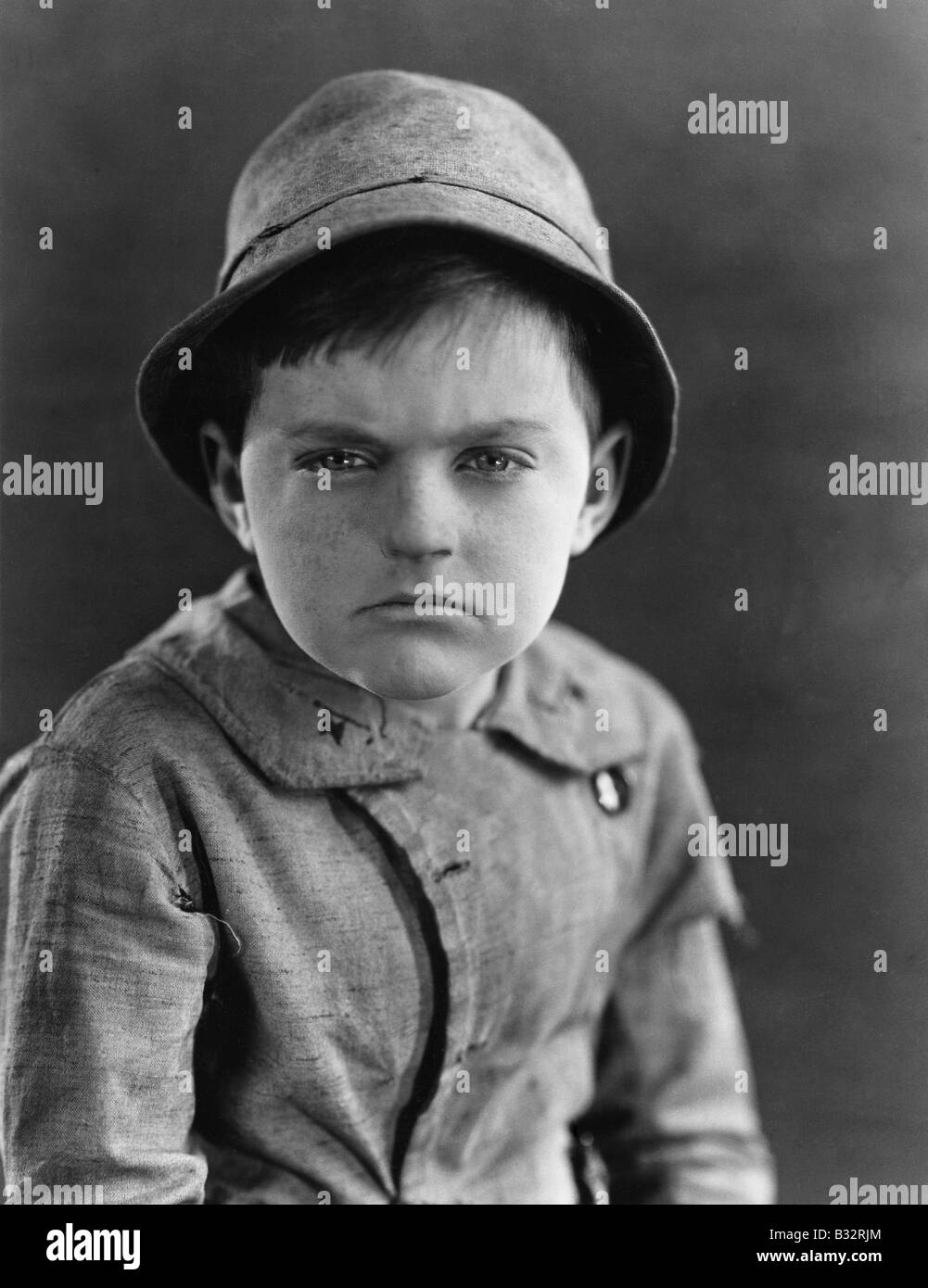 Portrait of a boy looking serious Stock Photo - Alamy