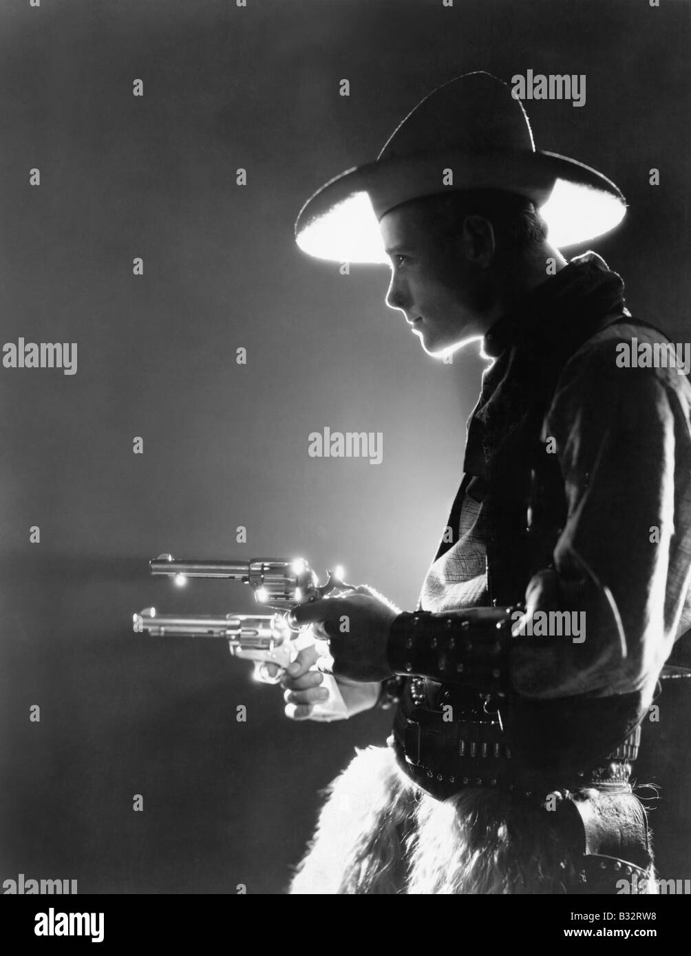 Holding guns Black and White Stock Photos Images Alamy