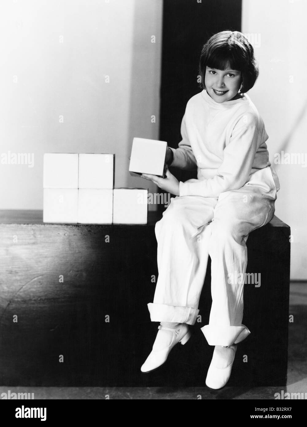 Portrait Of A Young Girl Playing With Blocks Stock Photo Alamy