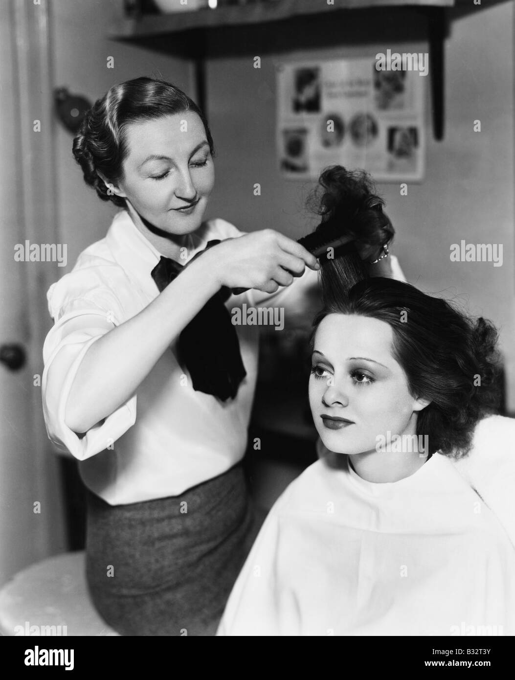 Young woman getting her done in a hair salon Stock Photo