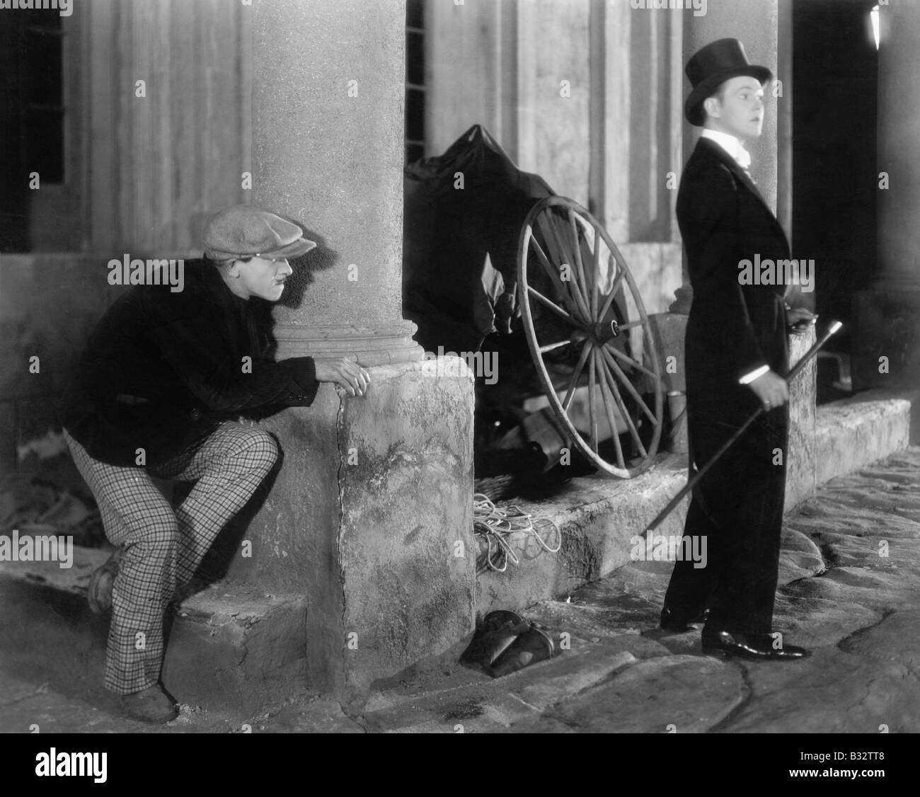 Man in formal attire being stalked by a burglar Stock Photo - Alamy