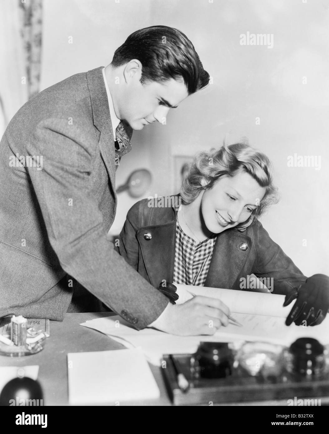 Couple reading a document together Stock Photo