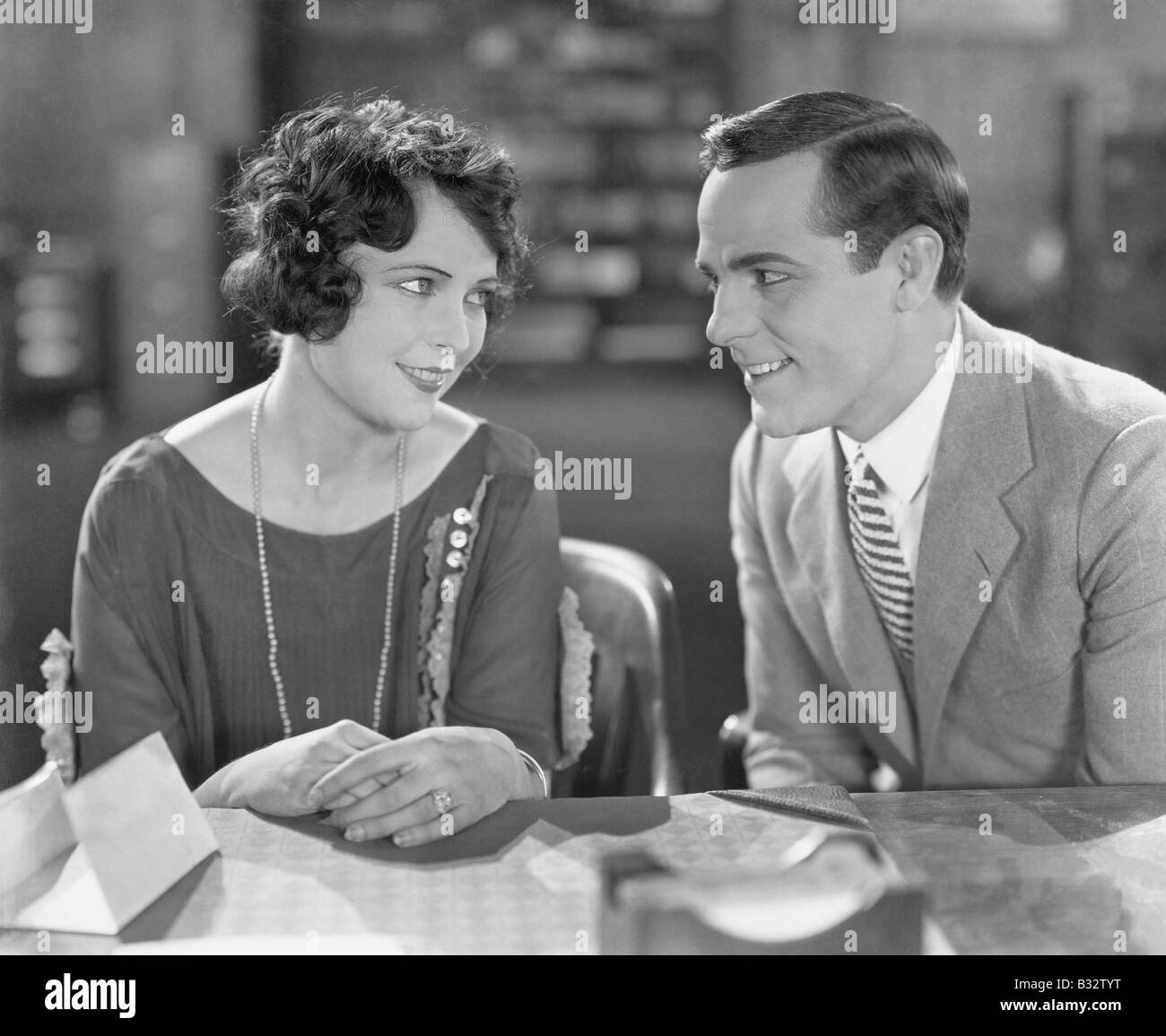 Couple sitting together and flirting Stock Photo