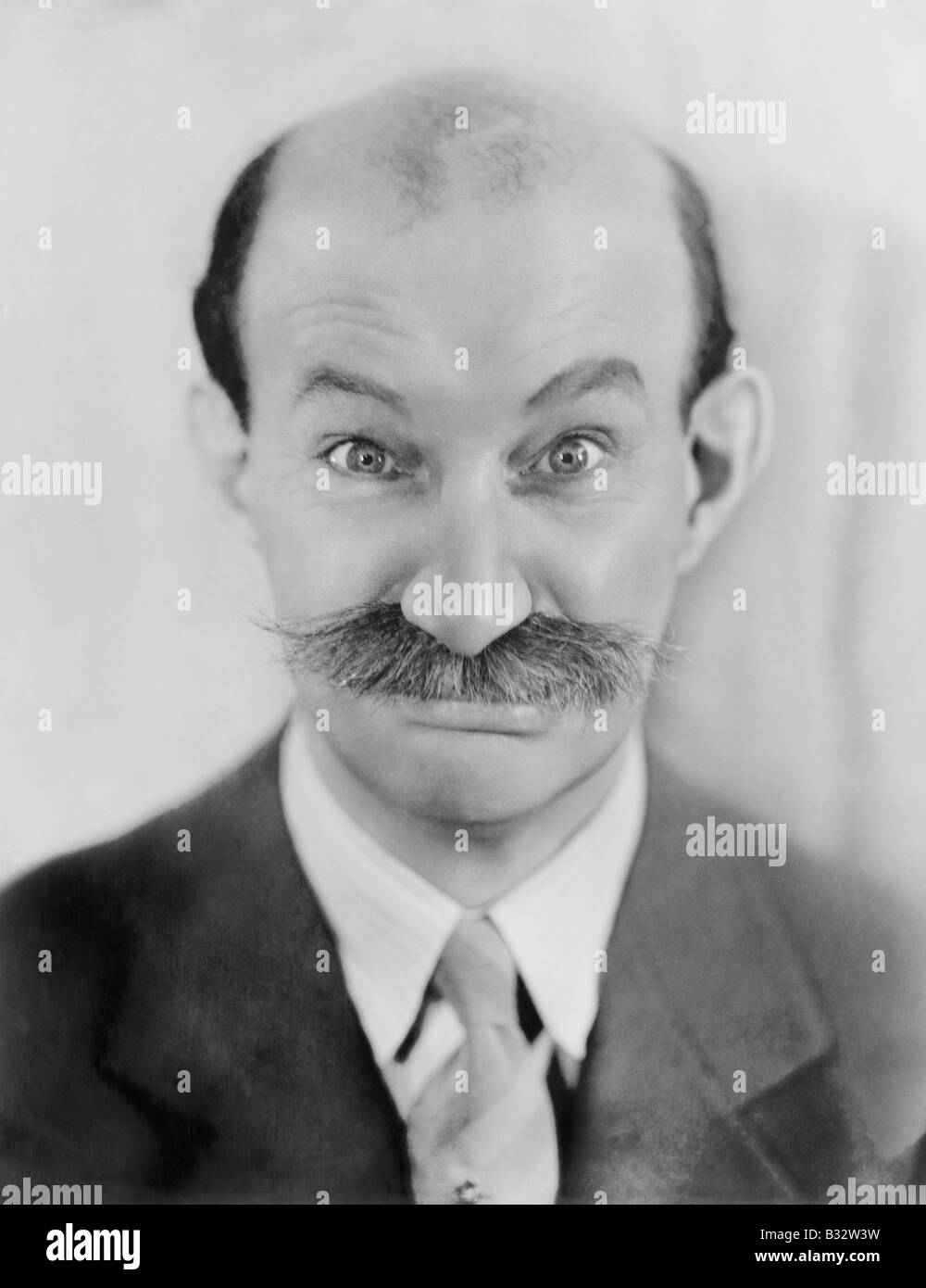 Man with mustache making a funny face Stock Photo