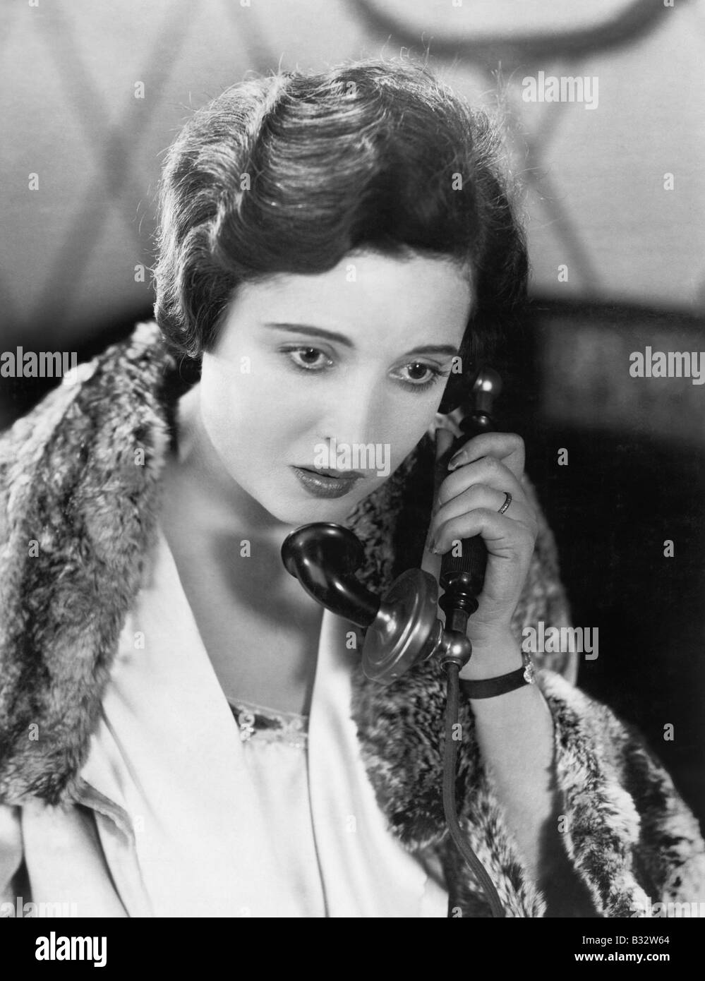 Young woman on the telephone Stock Photo