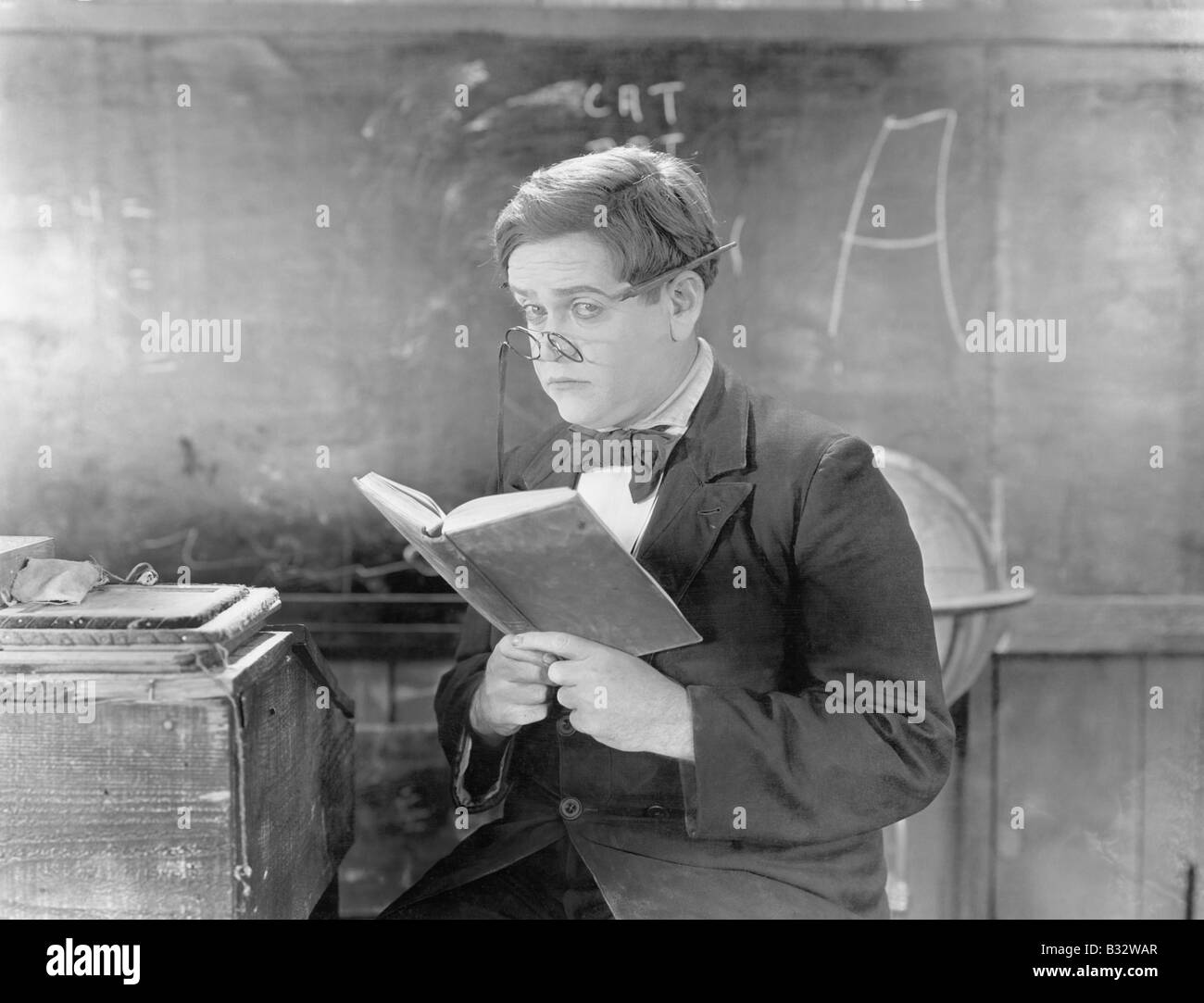 Teachers holding books Black and White Stock Photos & Images - Alamy