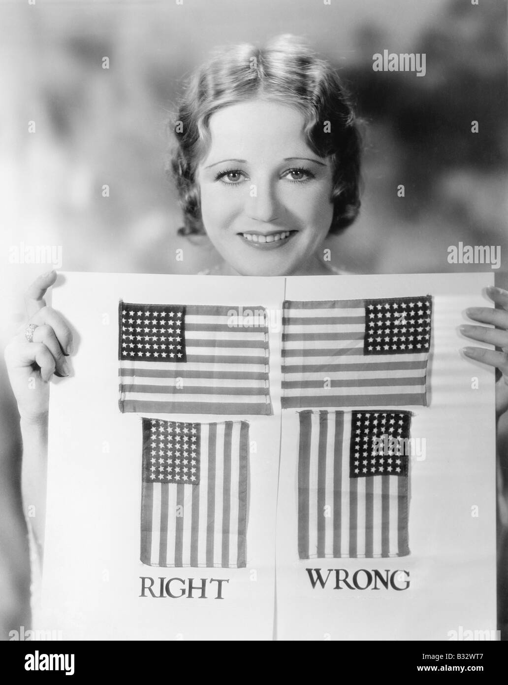 Young Woman Holding A Diagram Of How To Hang An American Flag Stock Young woman holding a diagram of how to hang an american flag stock
