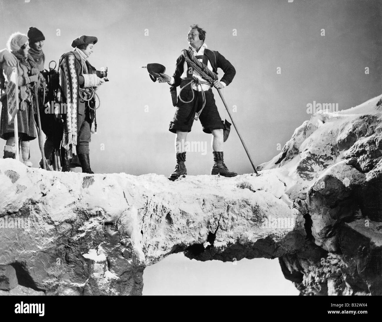 Group of people hiking in the mountains Stock Photo - Alamy
