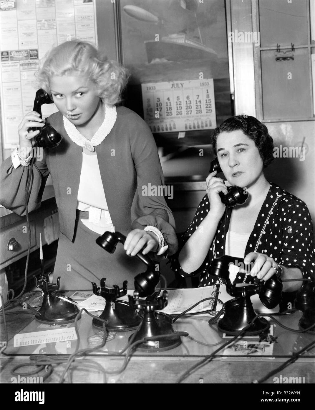 Two women working on a phone bank Stock Photo