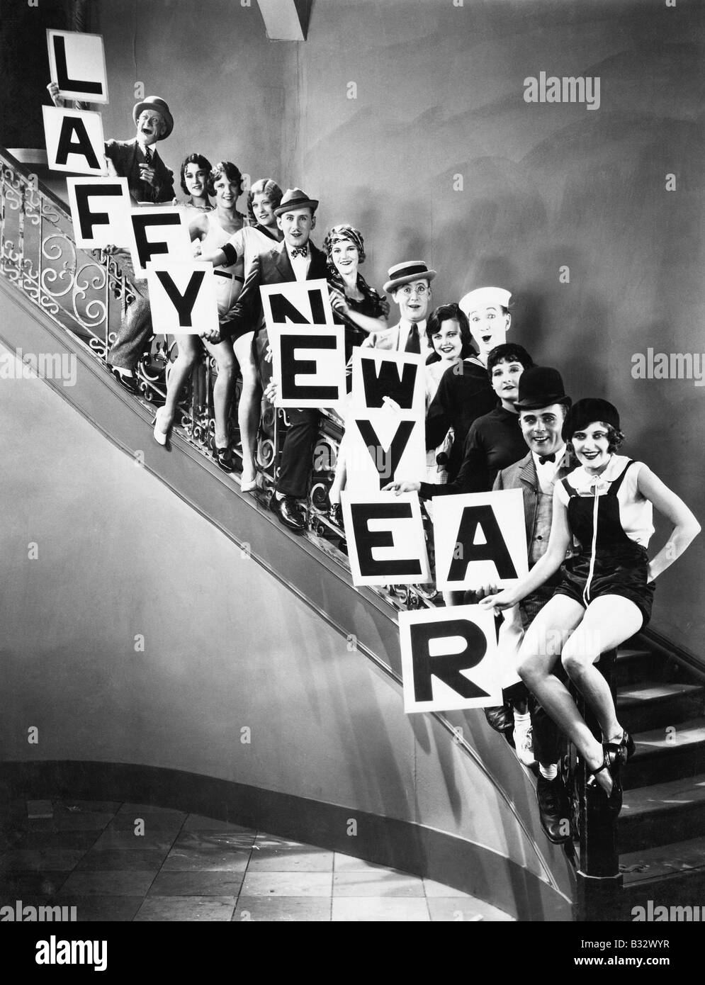 A chorus line standing on a curved stair case Stock Photo Alamy