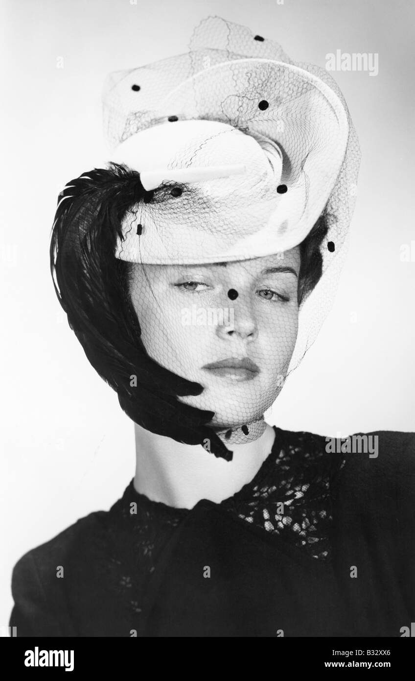 Elegant woman wearing an interesting hat with a veil Stock Photo Alamy