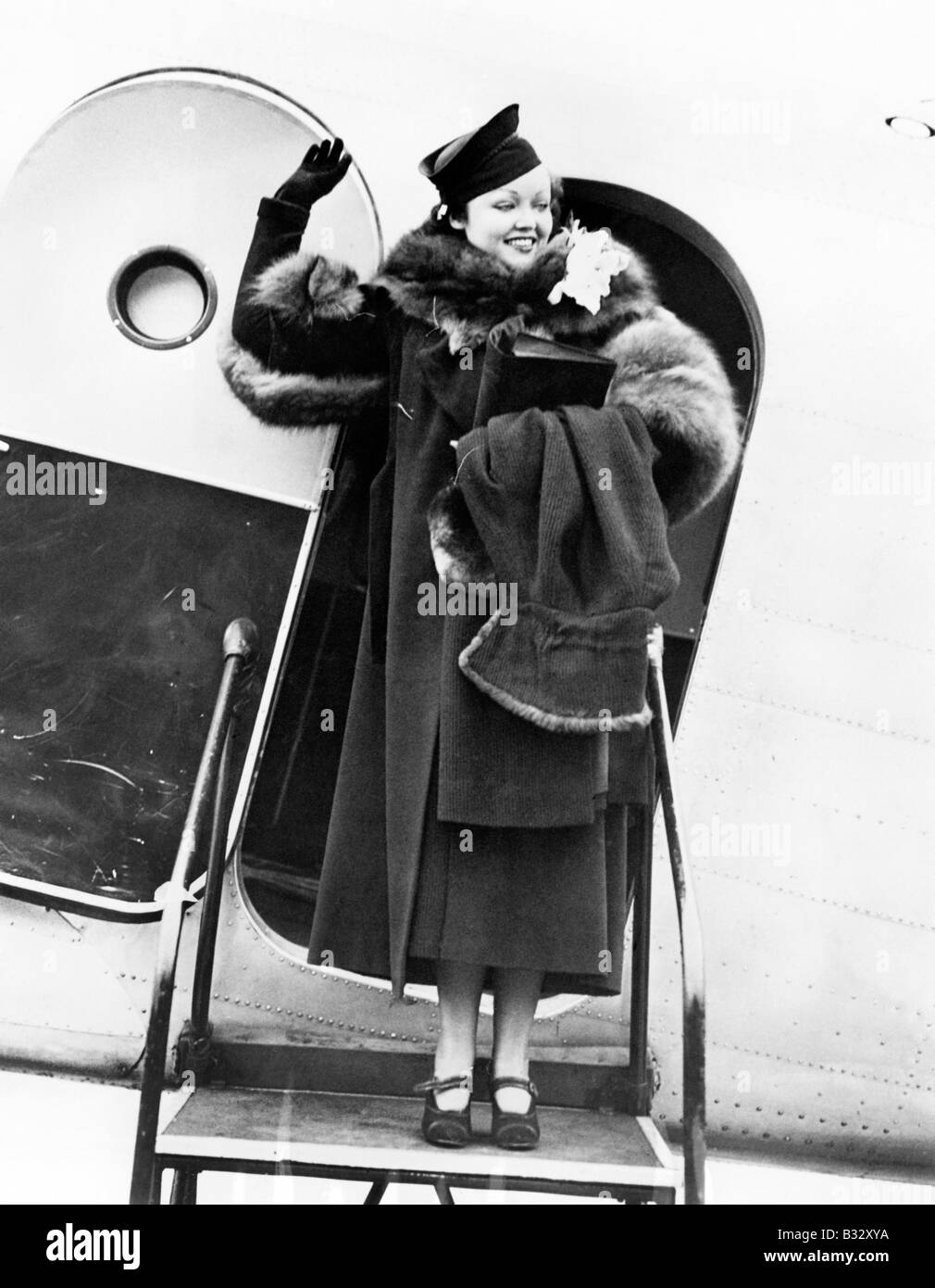 Woman steps plane happy hi-res stock photography and images - Alamy