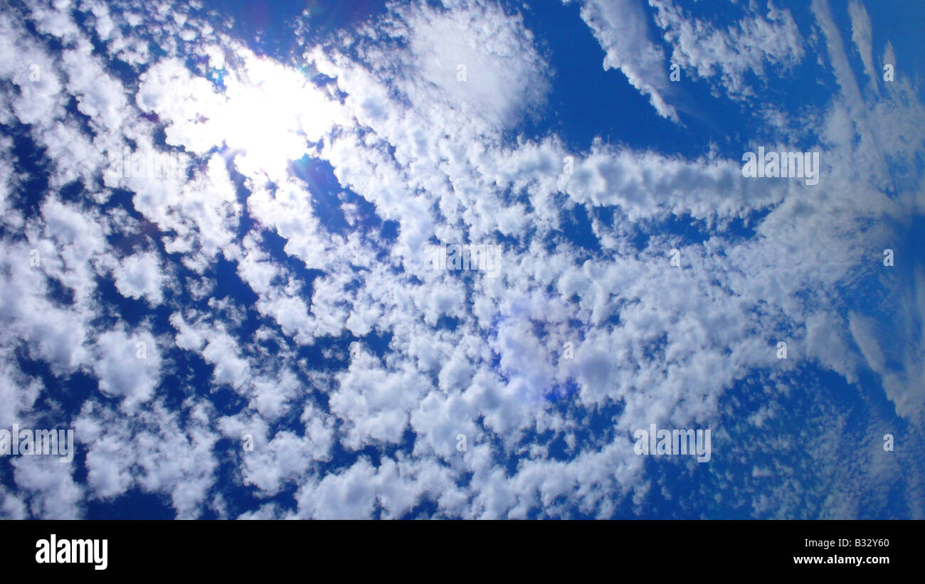 cloudy sky with sun Stock Photo - Alamy
