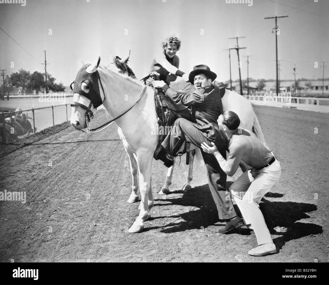 Man mounting horse Black and White Stock Photos & Images - Alamy