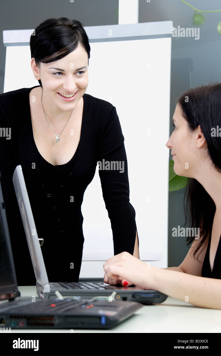 Women in the office under discussion Stock Photo Alamy