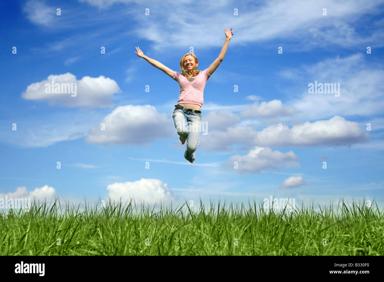 Woman makes air jump Stock Photo