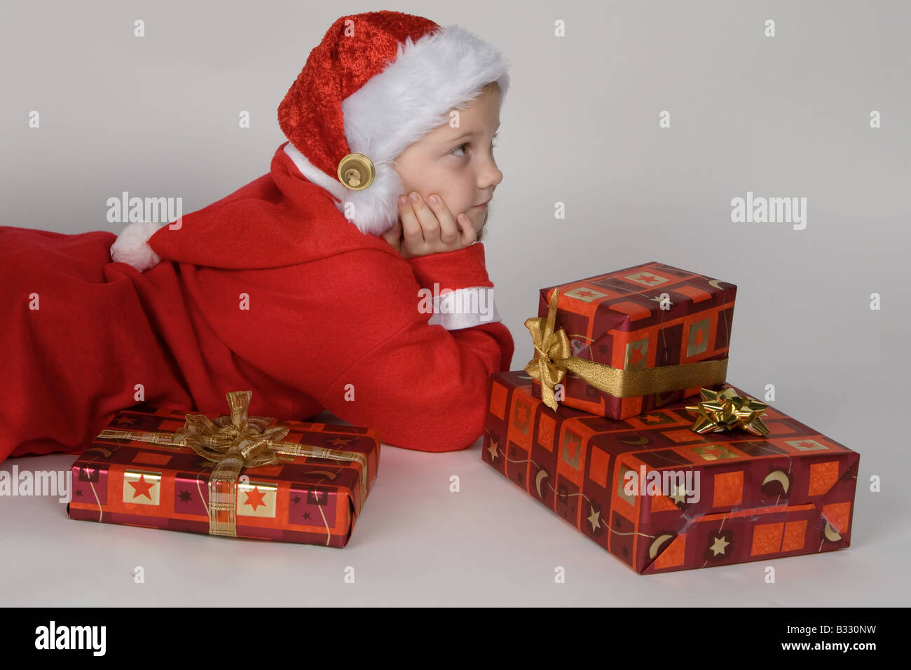 Child with Christmas gifts Stock Photo - Alamy