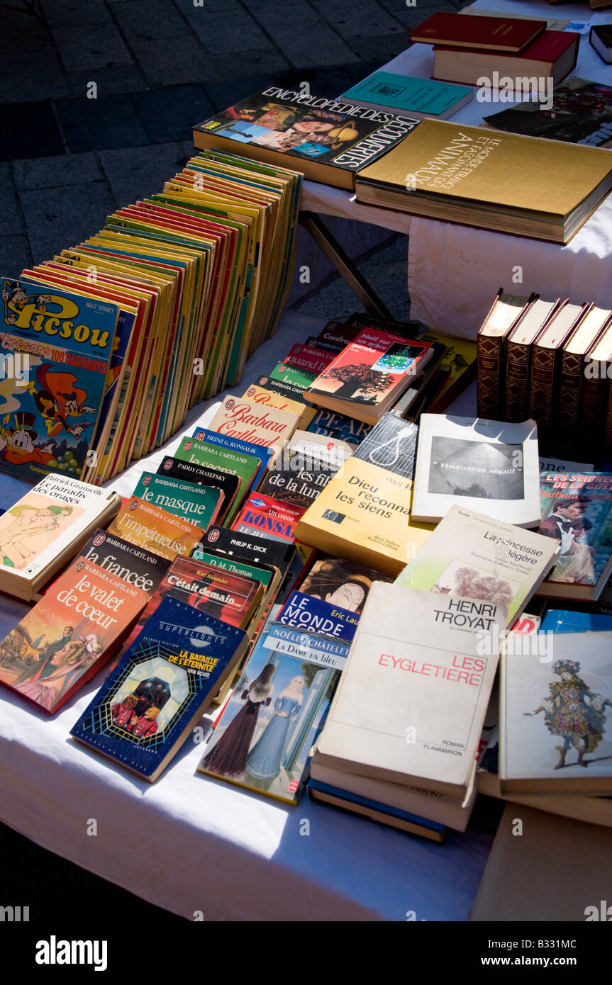 The display of books in the book market in Place du Palais, Old Town of Nice, Cote d'Azur, France Stock Photo