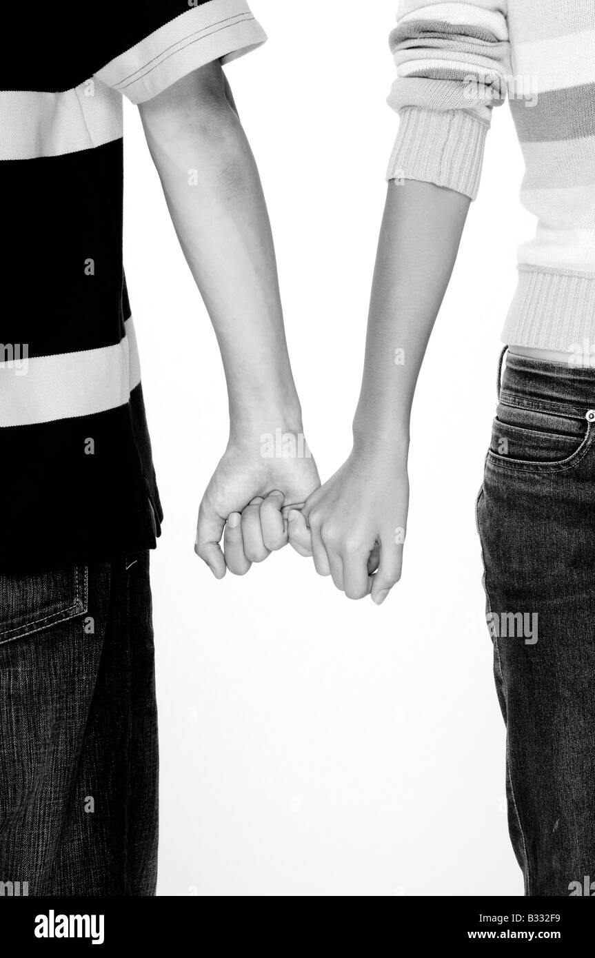 A monochrome picture of a couple holding hands Stock Photo