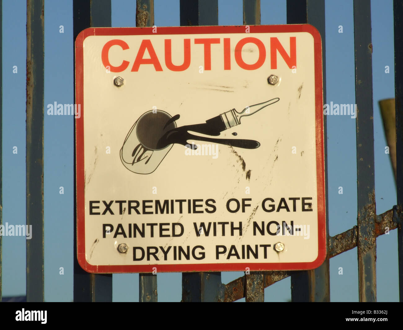 non drying paint warning notice sign on fence Stock Photo Alamy