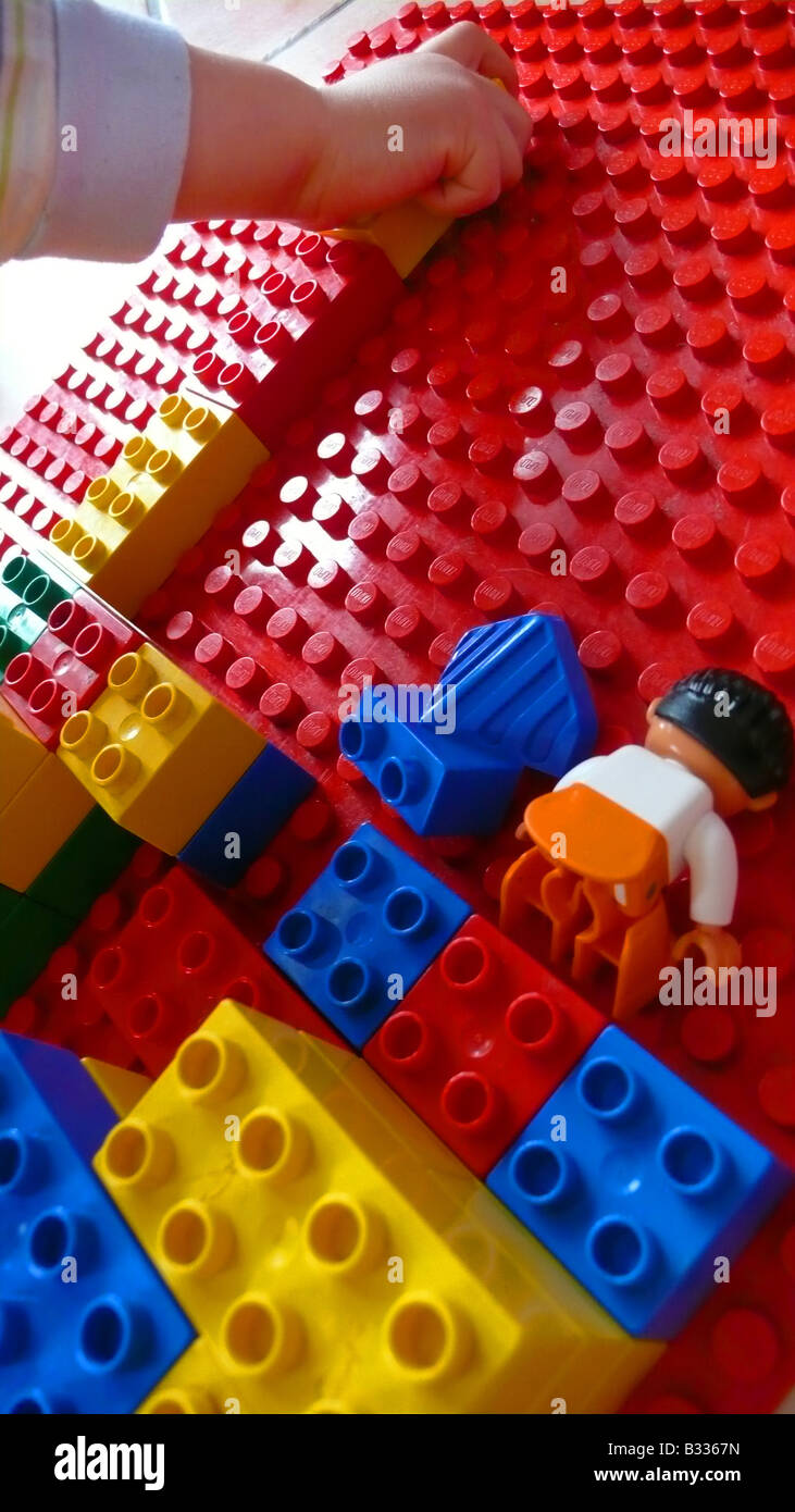 little boy playing with Lego bricks Stock Photo