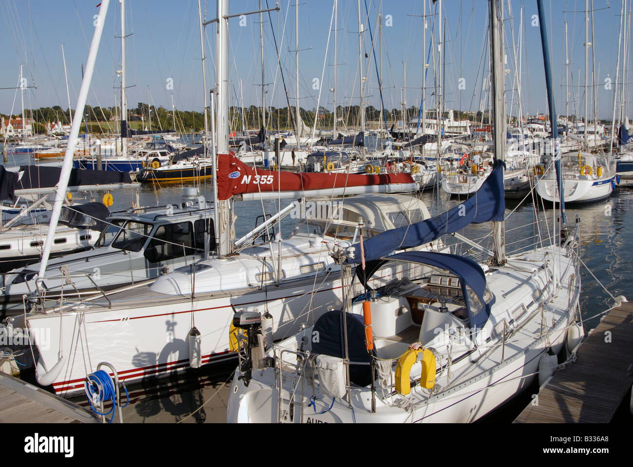 Yachts on marina pontoon moorings, River Hamble, Southampton, England